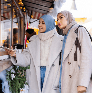 Two women wearing hijab out shopping